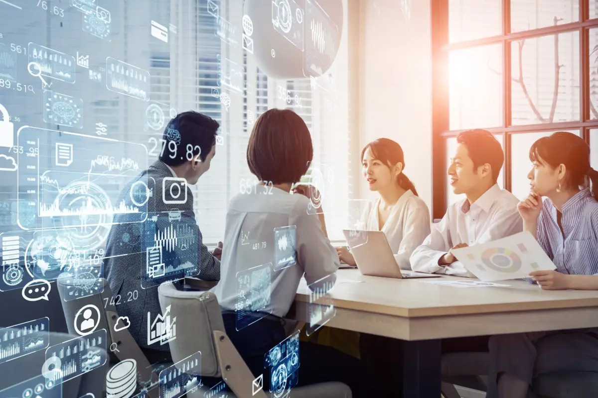 Business meeting with digital technology overlays.