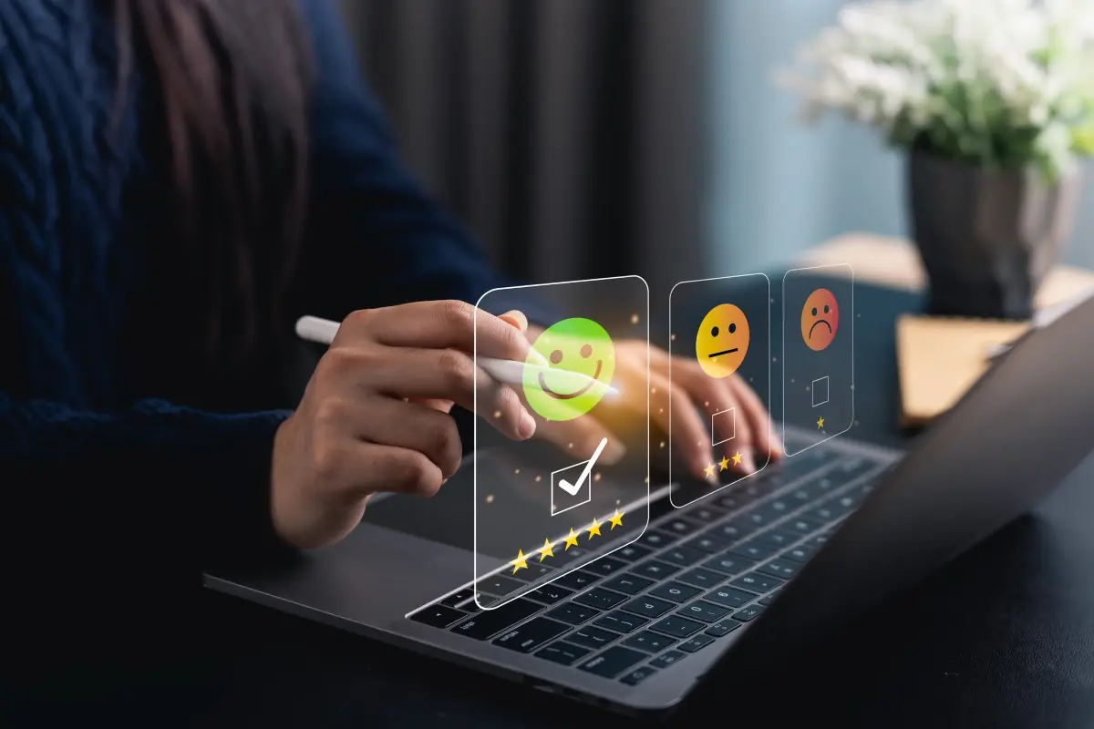 Person using laptop for online feedback survey.