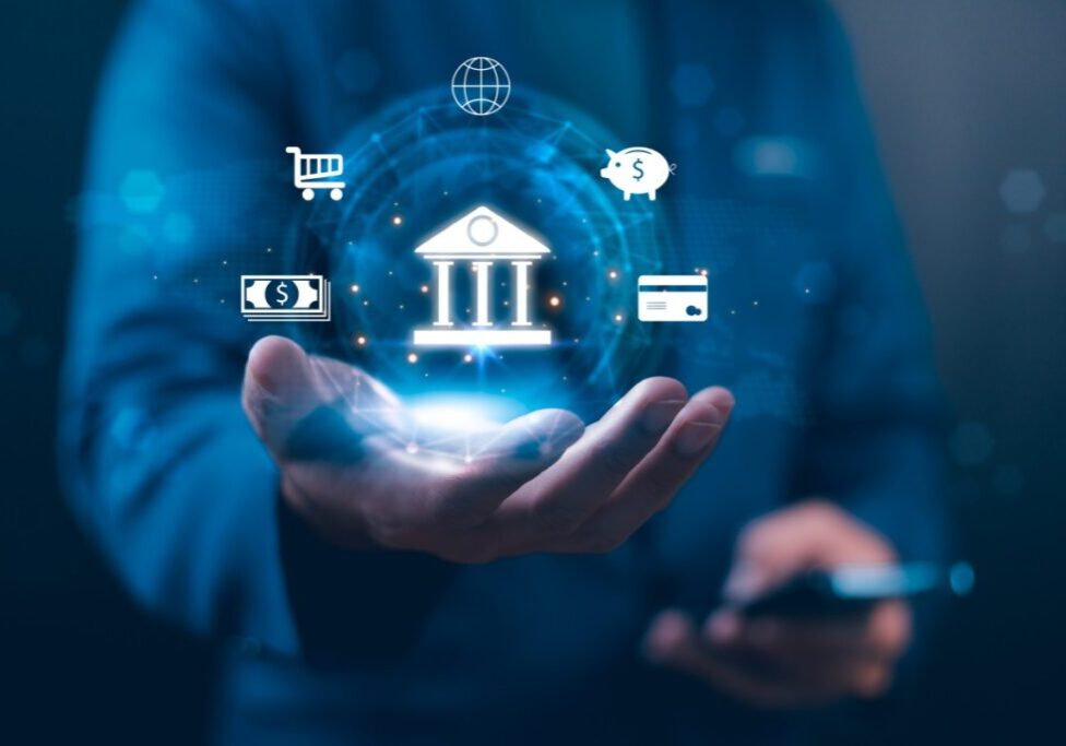 Digital banking icons hovering over hand.