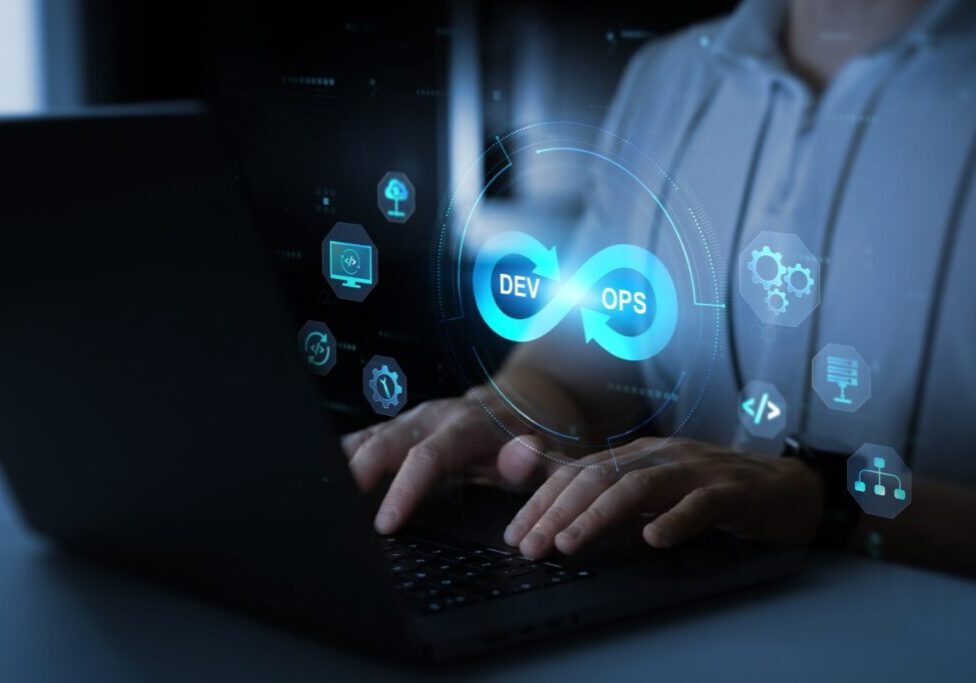 Person typing with DevOps graphic overlay.
